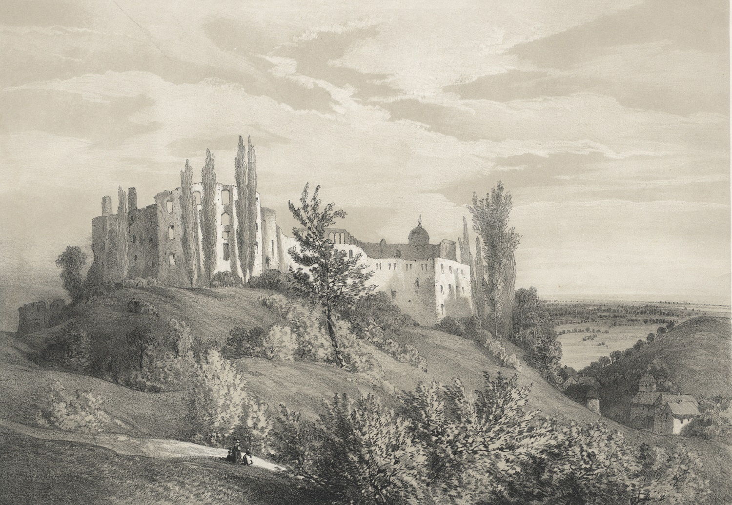 Rycina przedstawia ruiny starej budowli. Na wzgórzu porośniętym drzewami i krzewami ruiny zamku w Janowcu. Po prawej tronie, w dolinie poniżej domy i pola. Przed ruinami na drodze spacerujący ludzie.