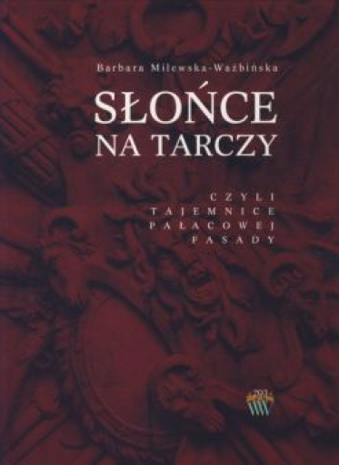 Bordowa okładka książki elementami rzeźbiarskimi przedstawiającymi m.in. maszkaron i elementy uzbrojenia